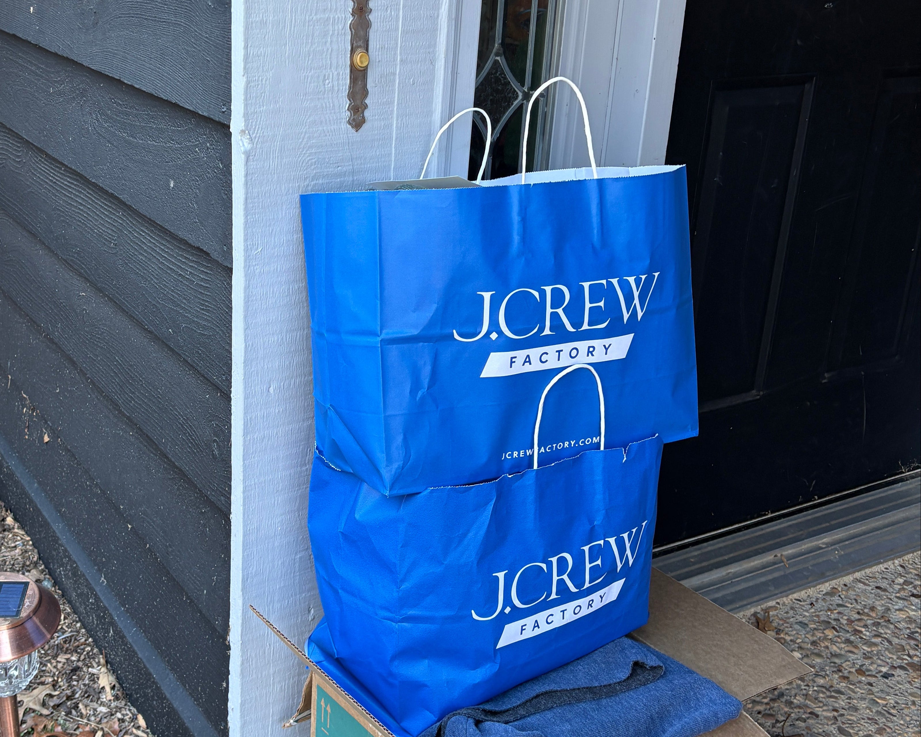 J. Crew Factory Paper bags sitting on front porch